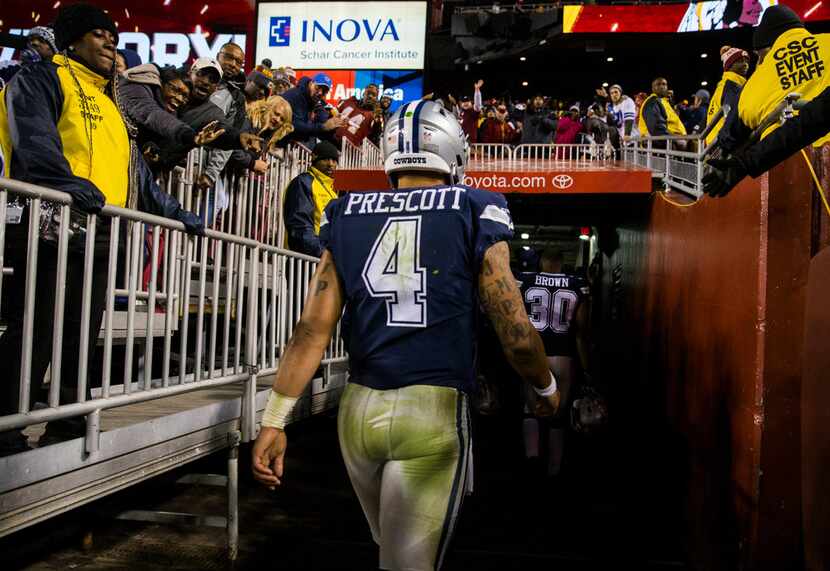 Dallas Cowboys quarterback Dak Prescott (4) leaves the stadium after the Dallas Cowboys lost...