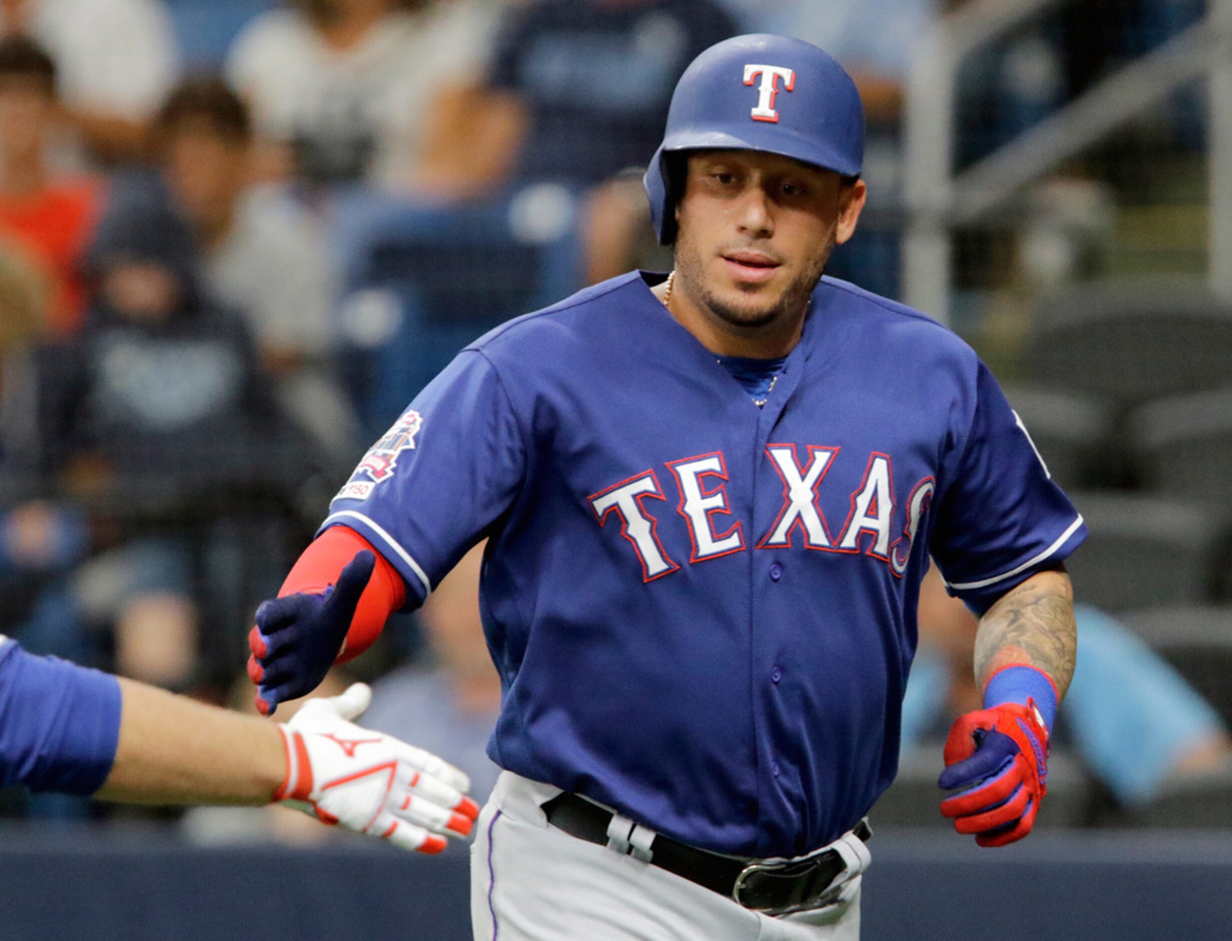 ST. PETERSBURG, FL - JUNE 29: Asdrubal Cabrera #14 of the Texas Rangers is congratulated...