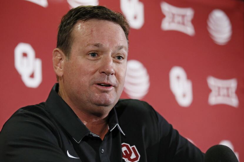 Oklahoma head coach Bob Stoops answers a question during an NCAA college football news...