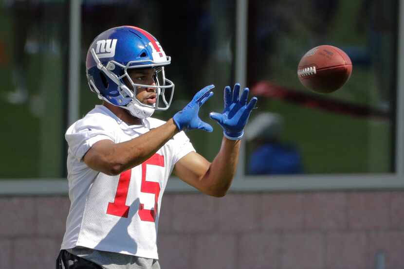 FILE - In a Tuesday, June 4, 2019 file photo, New York Giants' Golden Tate runs a drill...