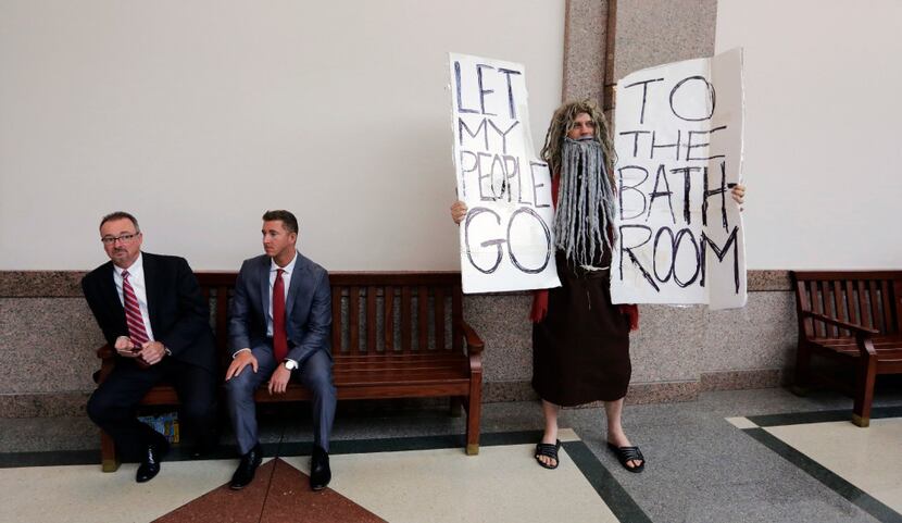 John Erler protests as the Senate State Affairs Committee begin hearings about Senate Bill 6...