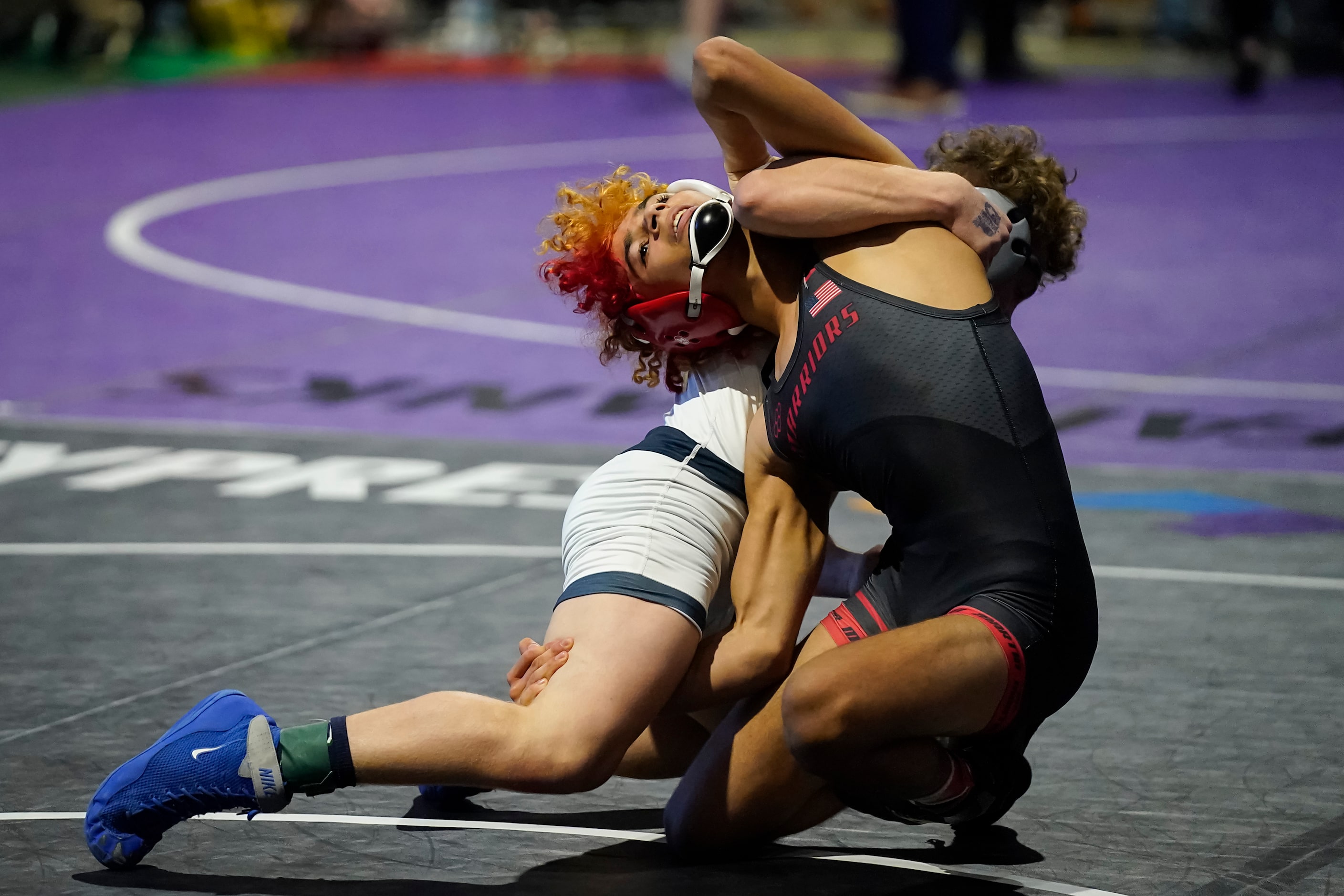 Shawn Ryncarz of Arlington Martin wrestles Anthony Marino of Conroe Woodlands College Park...