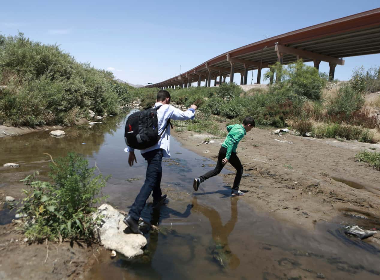 In this June 7, 2019 photo, people cross the Rio Grande into the United States to turn...