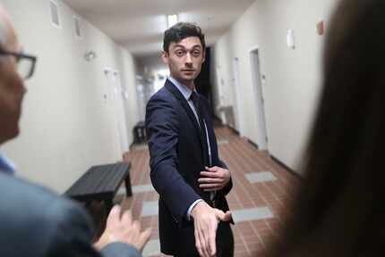 Democratic candidate Jon Ossoff speaks with the media at a campaign office as he runs for...