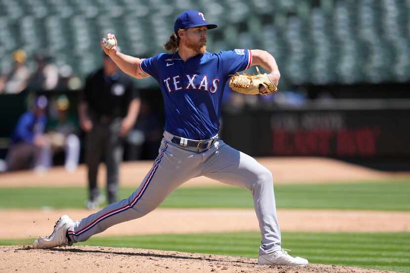 Texas Rangers pitcher Jon Gray works against the Oakland Athletics during the sixth inning...