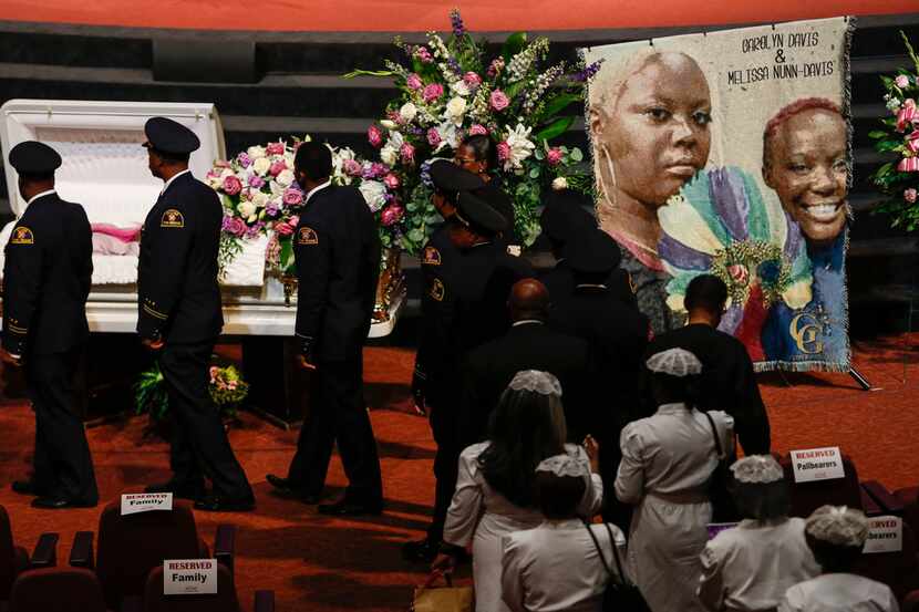 People viewed the open caskets during services for former Dallas  City Council member...