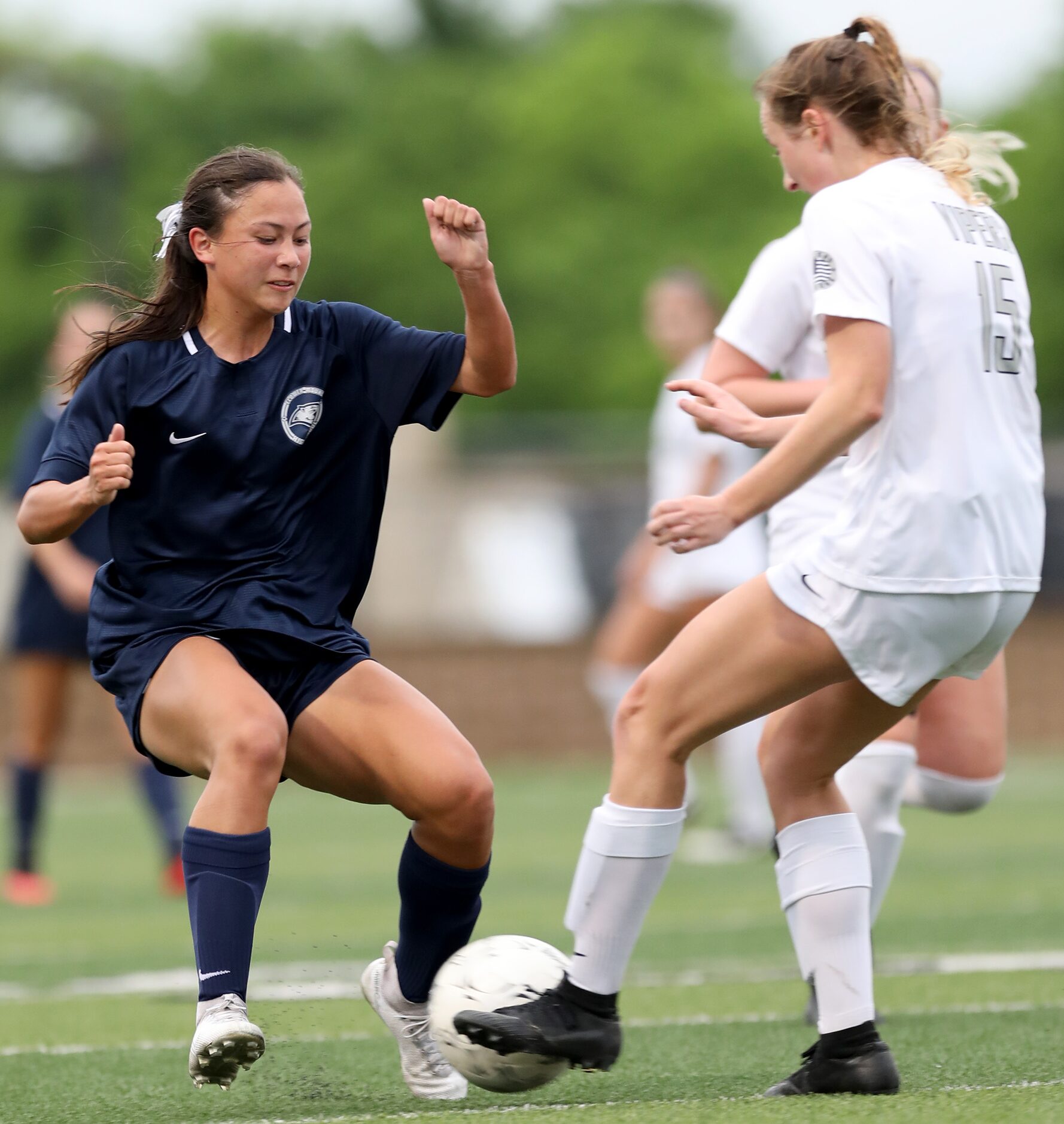 Lewisville Flower Mound's Emma Hoang (23) and Austin Vandegrift's Evan Ormond (15) struggle...