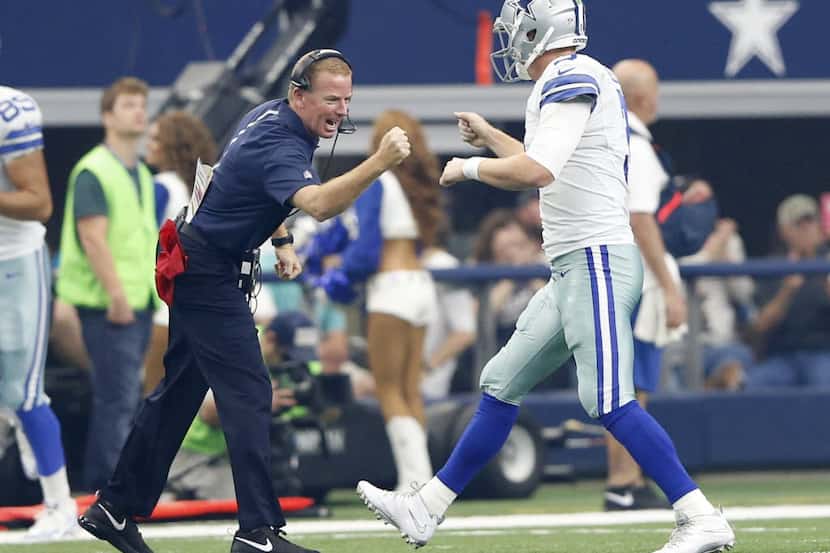 Dallas Cowboys head coach Jason Garrett congratulates Dallas Cowboys quarterback Brandon...