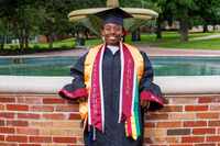 Hana Taylor Schlitz wears her cap and gown on the Texas Woman’s University campus, Thursday,...
