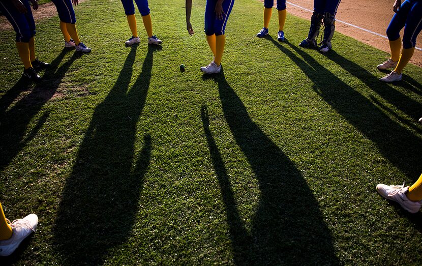  Frisco's Emma Ortiz (3, center) reaches down to get a dropped hacky sack while hear team...