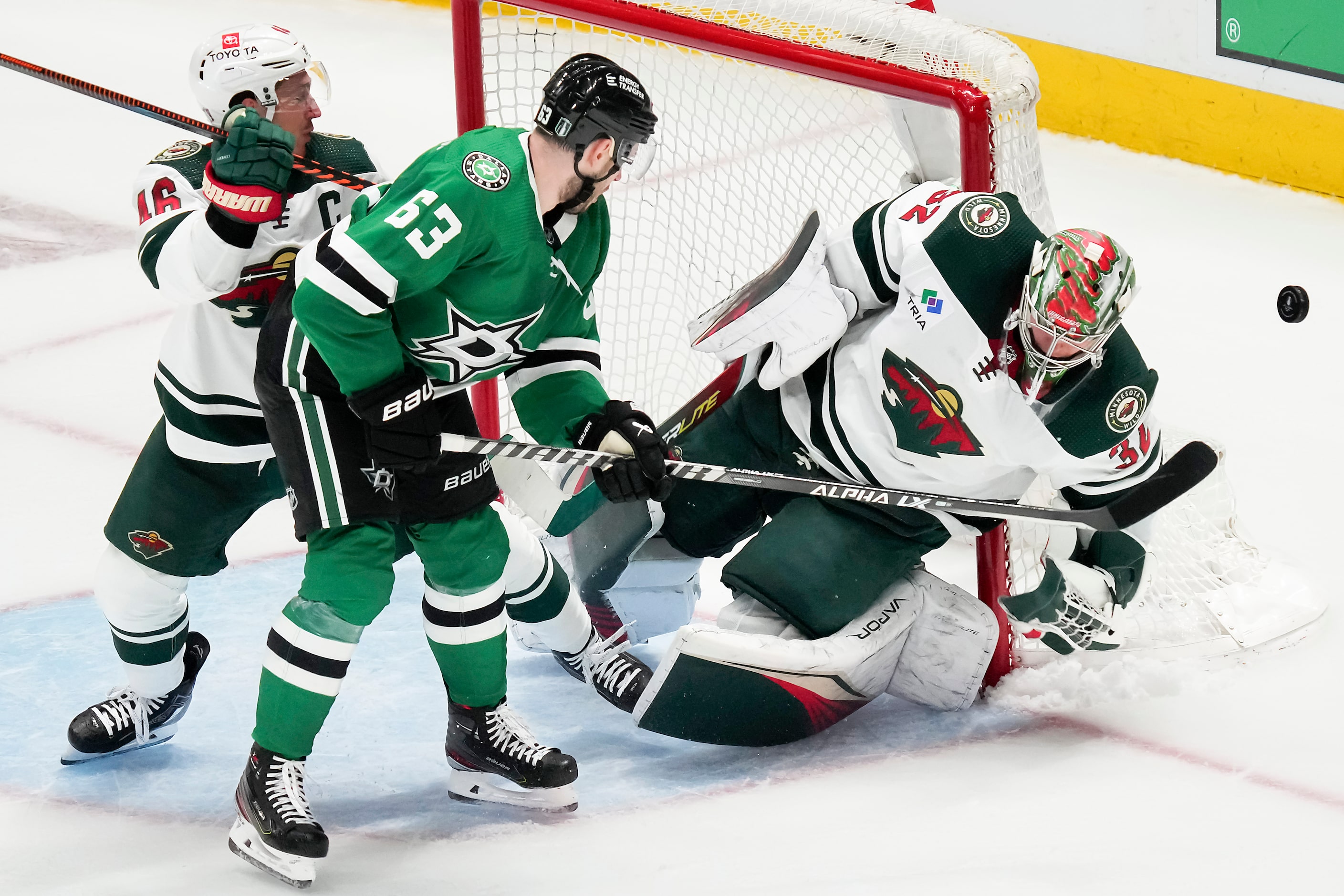 Minnesota Wild goaltender Filip Gustavsson (32) turns away Dallas Stars right wing Evgenii...