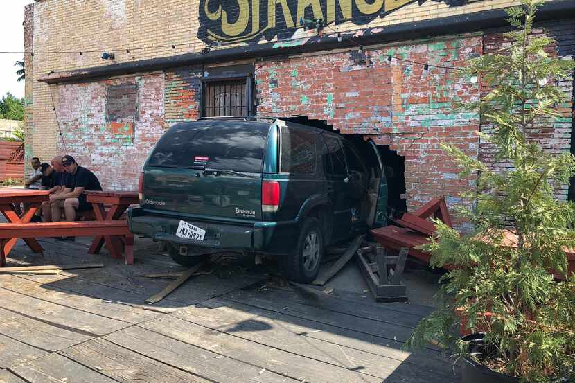 A car crashed through the front wall of beloved dive Strangeways on Sunday, May 27. 