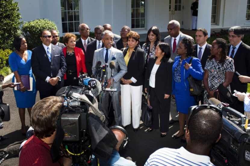 The Rev. Al Sharpton, flanked by other civil rights leaders and politicians, spoke Monday at...