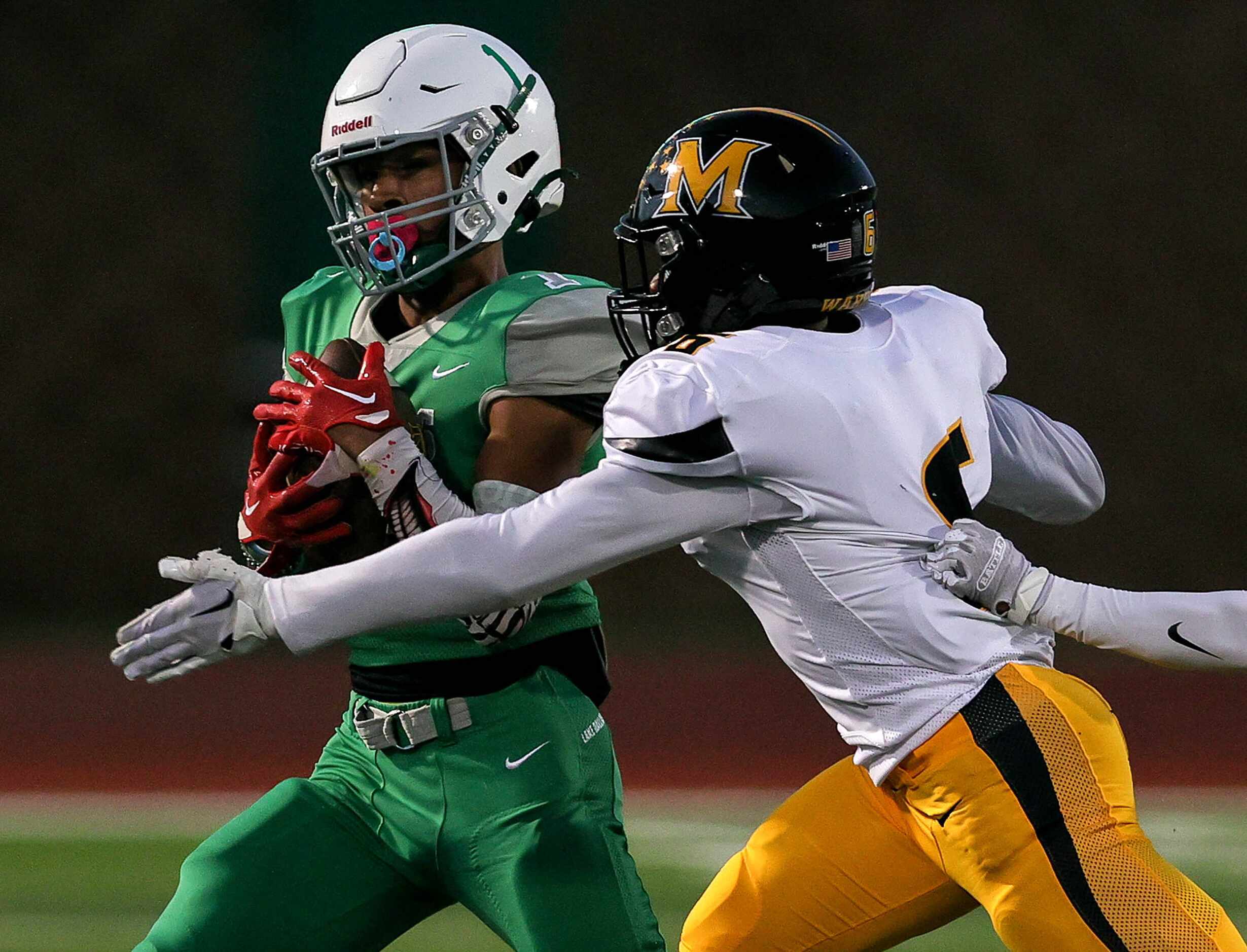 Lake Dallas wide receiver Niki Gray (1) comes up with a reception against Frisco Memorial...