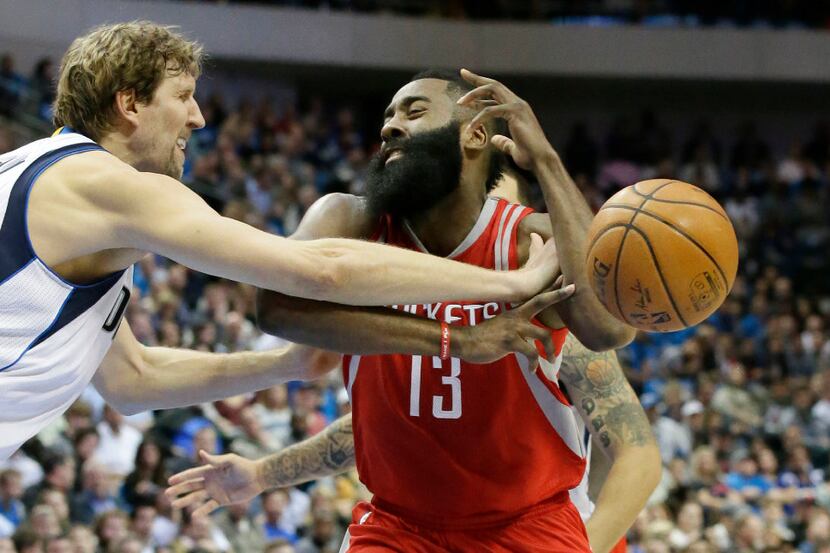 Houston Rockets guard James Harden (13) had the ball pushed away by Dallas Mavericks...
