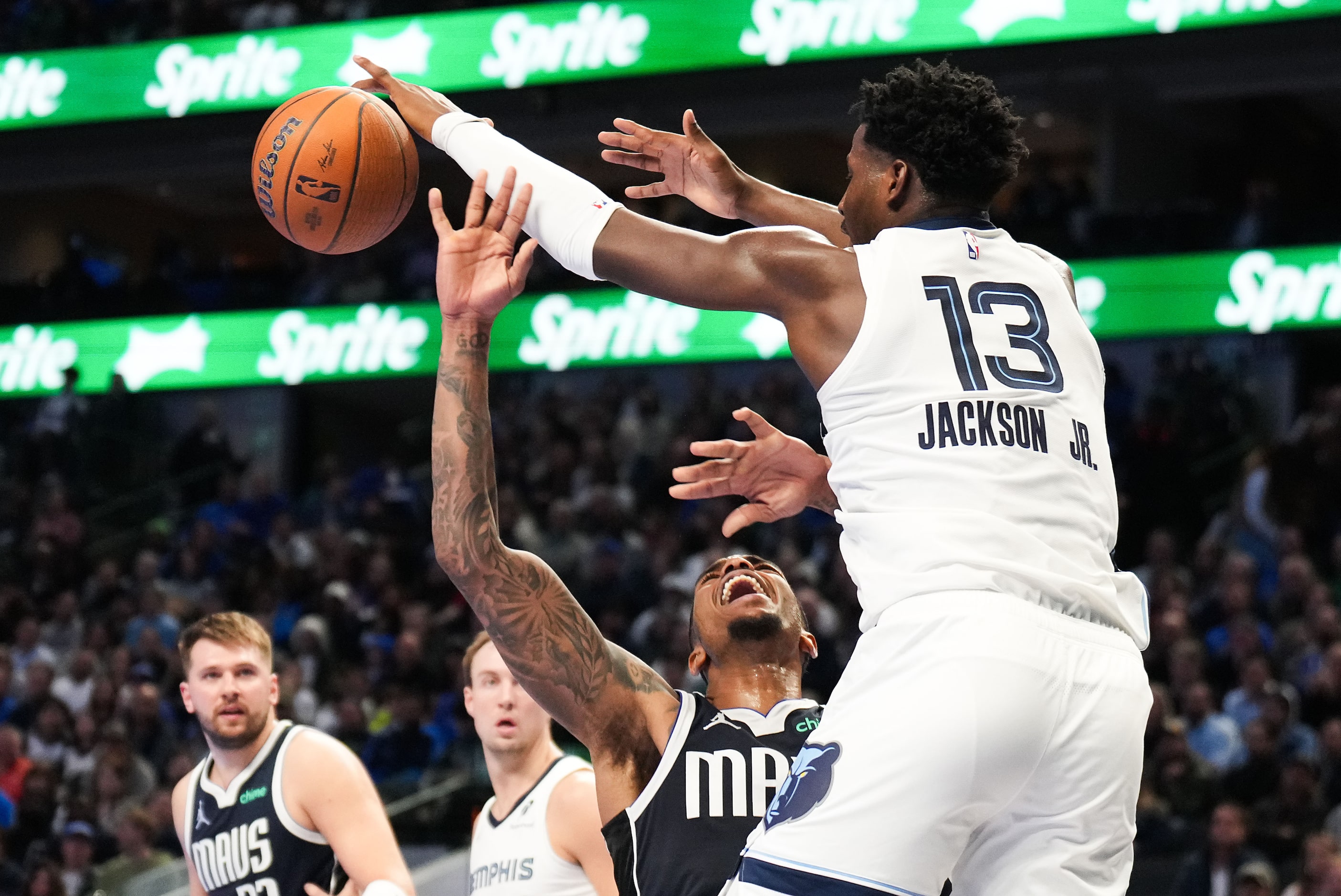 Dallas Mavericks forward P.J. Washington (25) is fouled by Memphis Grizzlies forward Jaren...