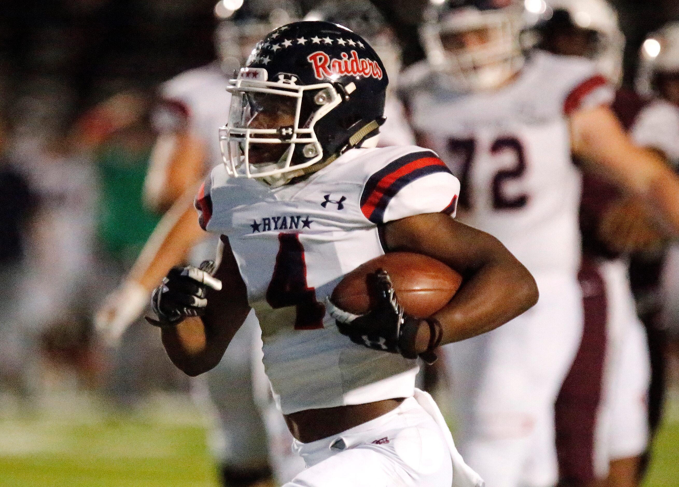 Denton Ryan High School running back Jordan Bailey (4) carries the football into the end...