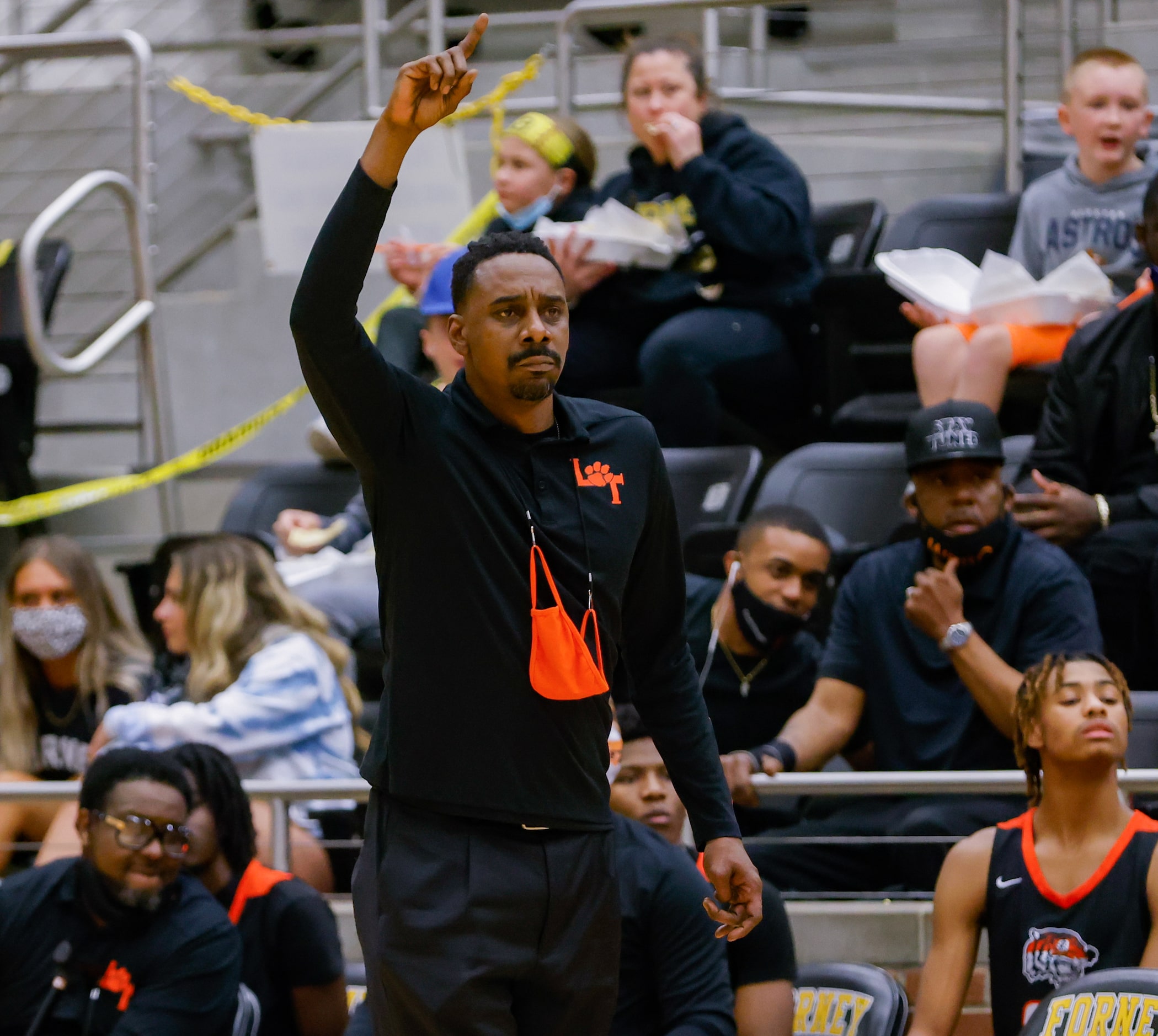 Lancaster's coach Ferrin Douglas during during the first half of a boys basketball UIL Class...