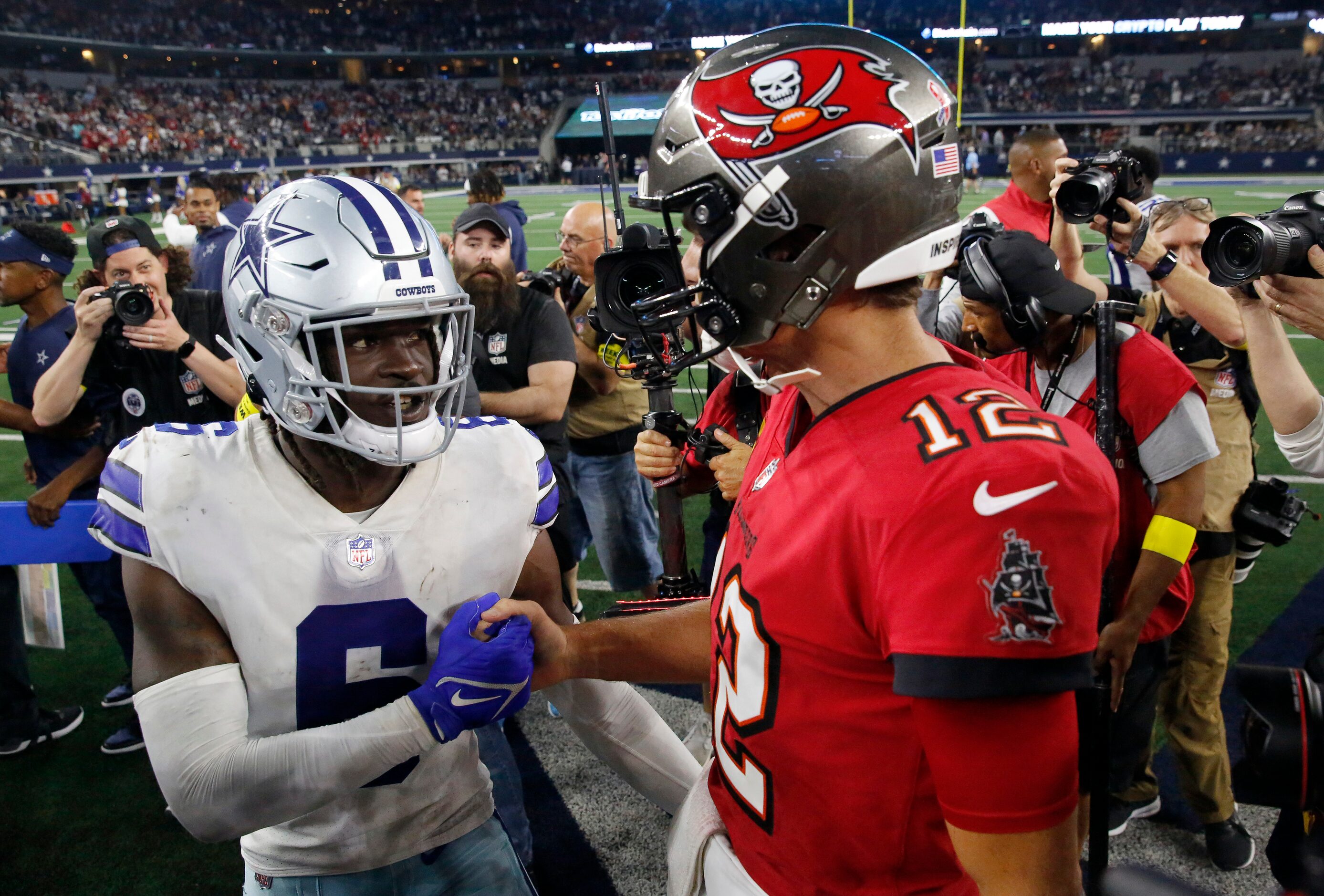 Dallas Cowboys safety Donovan Wilson (6) congratulates Tampa Bay Buccaneers quarterback Tom...