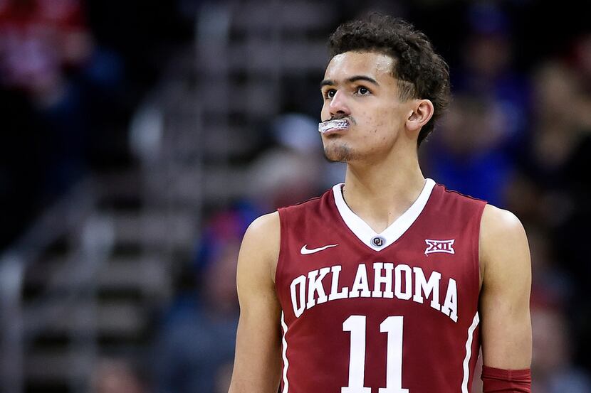 Oklahoma's Trae Young watches the final seconds tick off the clock during the second half...