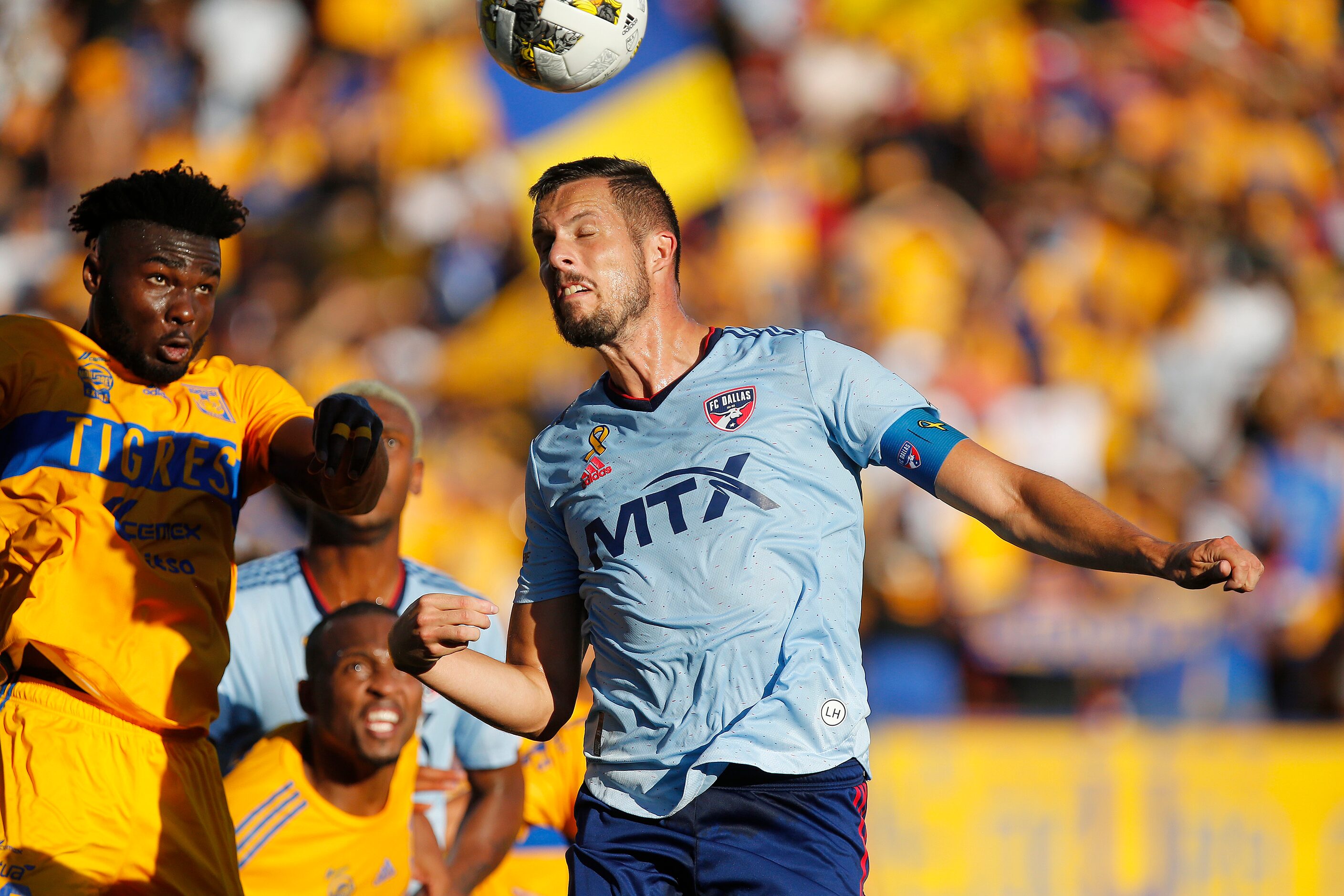 FC Dallas defender Matt Hedges (24) gets a header in front of Tigres UANL defender Jordy...