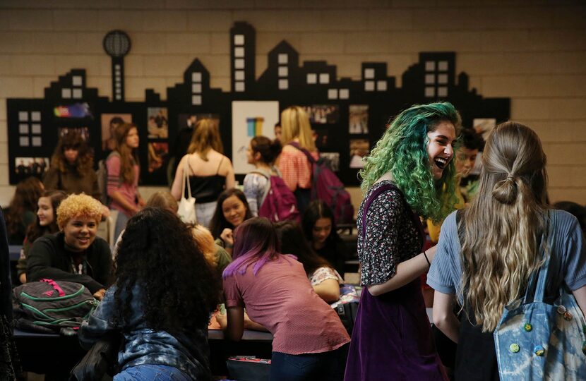 Isabella Bruner, a junior, speaks to her peer during the first day of school in the 2017...