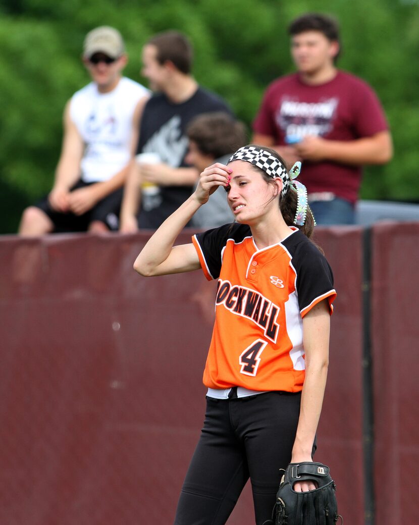 Rockwall center fielder Peyton Mills (4) awaits her opportunity to make a defensive play...