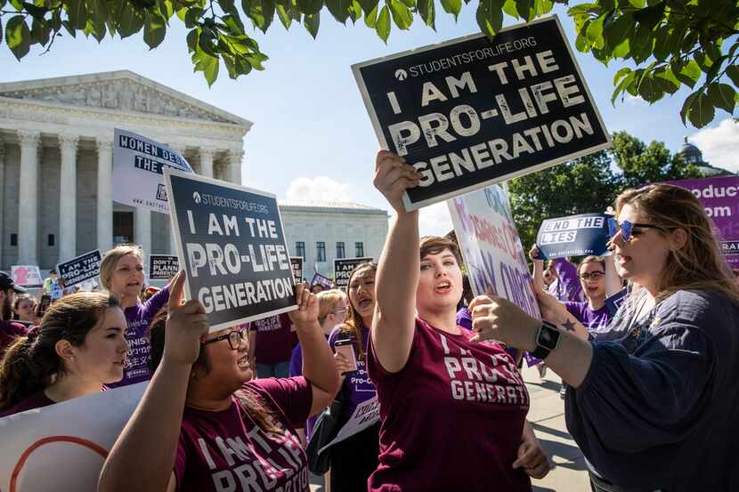 Demonstrators on both sides of the abortion issue demonstrate in front of the Supreme Court...