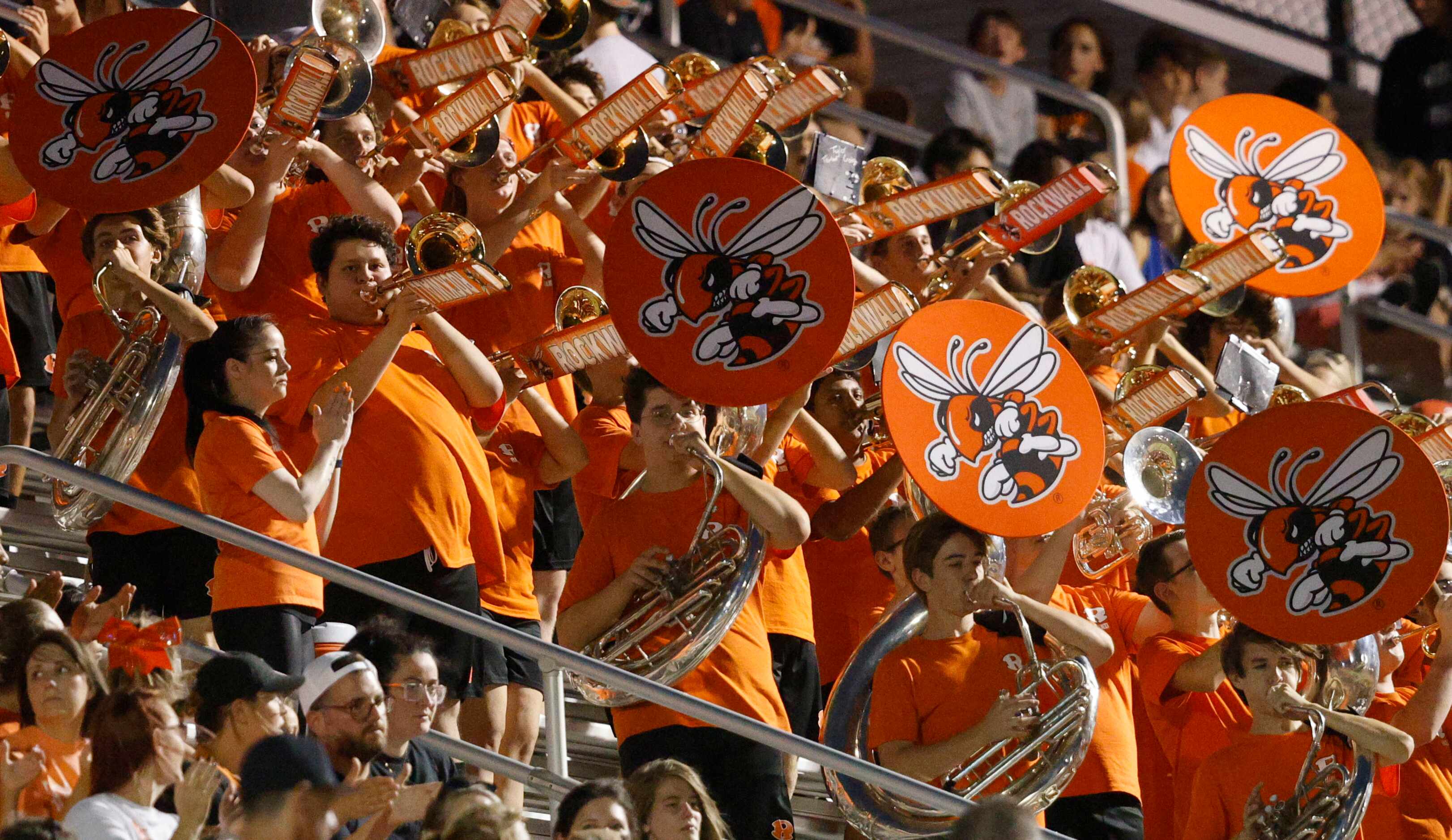 Rockwall High School Orange Wave Band performs during the first half of a high school...