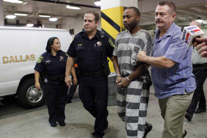 Van Dralan Dixson was shackled and handcuffed as police escorted him into the Dallas County...