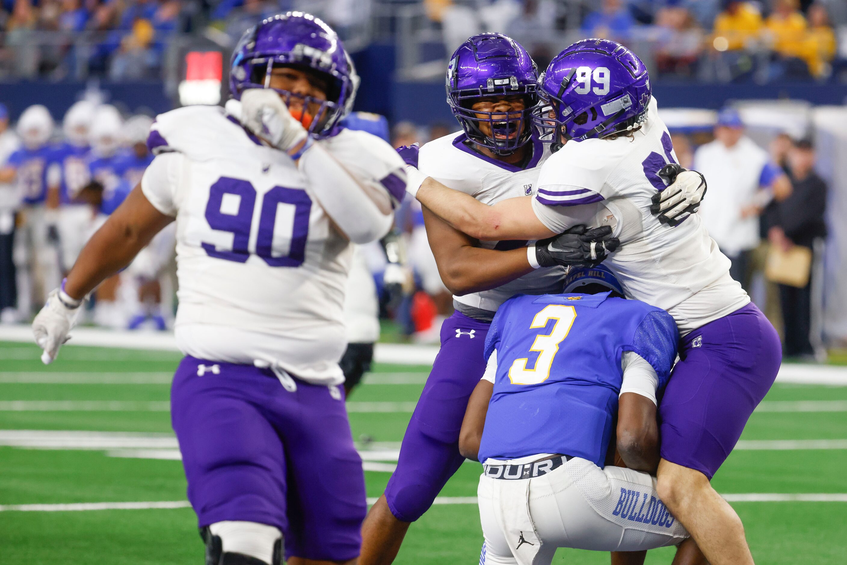 Anna High’s Nathan Nickerson (back left) celebrates with Alex Martinez as Nickerson sacks...