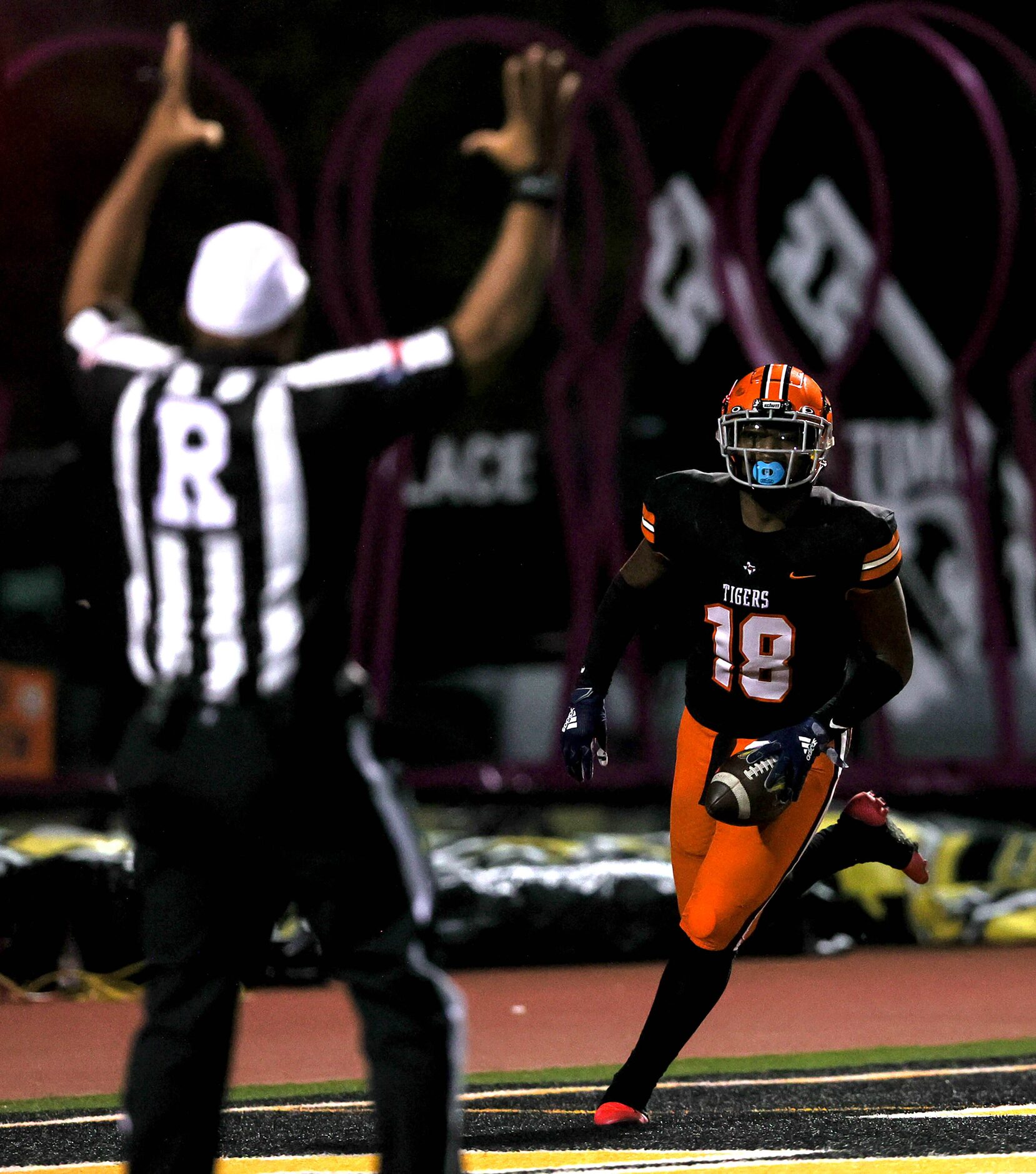 Lancaster defensive end Jamel Jones gets into the endzone  after picking up a fumble and...