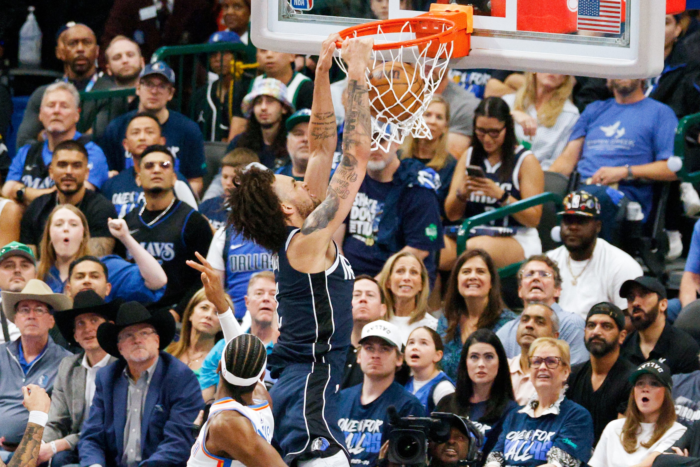 Dallas Mavericks center Dereck Lively II (2) dunks against the Oklahoma City Thunder during ...