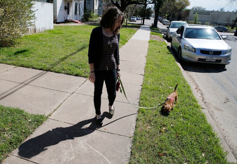 Audrey walks Gracie before going to work in Waco. (Vernon Bryant/Staff Photographer) 
