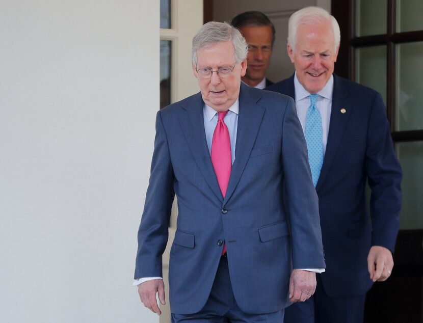 Senate Majority Leader Mitch McConnell of Ky., followed by Senate Majority Whip John Cornyn...