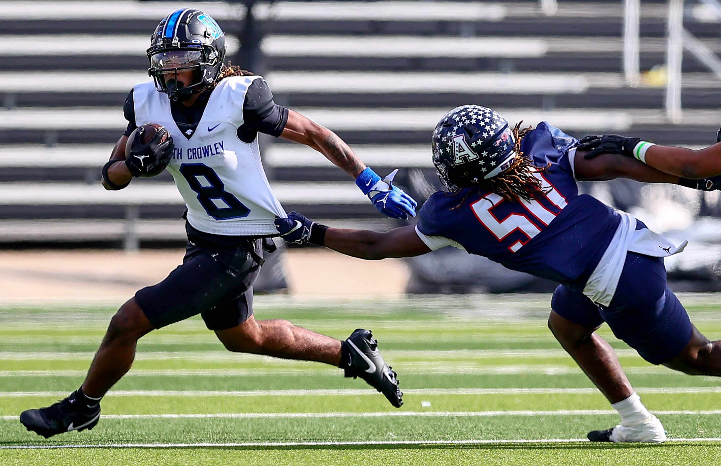 North Crowley running back Ashton Searl (8) tries to get past Allen linebacker Japrei Wafter...