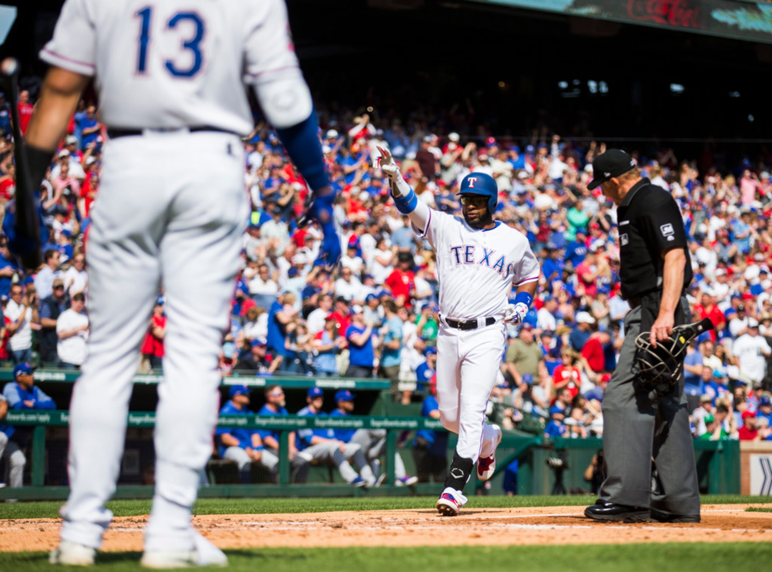 Texas Rangers shortstop Elvis Andrus (1) celebrates after a home run during the third inning...