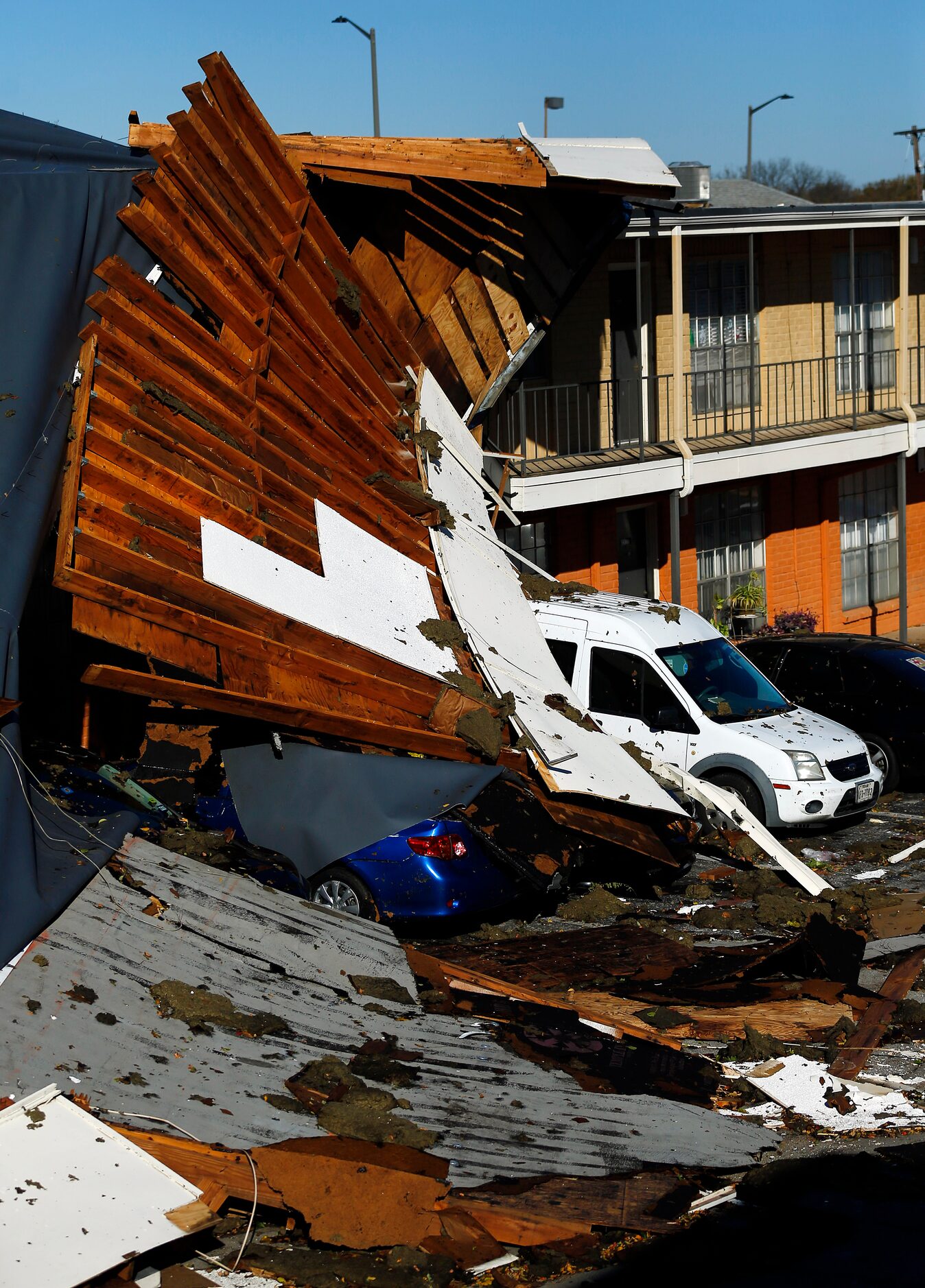 The roof of a Waterdance Apartments building was peeled off by a tornado-warned storm...