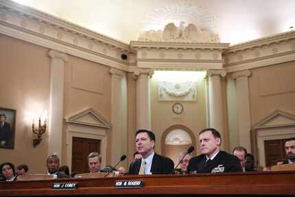 FBI Director James Comey and NSA chief Mike Rogers, right, appear in front of the House...