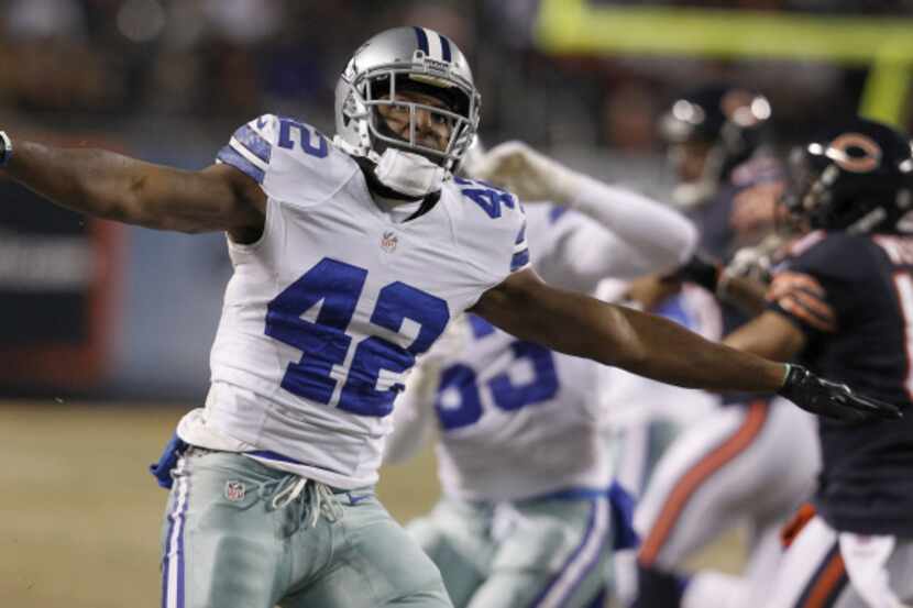 Dallas Cowboys free safety Barry Church (42) reacts to making a stop against Chicago Bears...