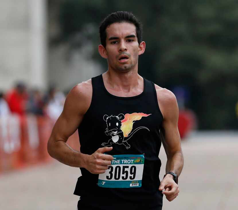 Mark Pinales wins third place in the men's 8-mile run at the Dallas YMCA Turkey Trot in...