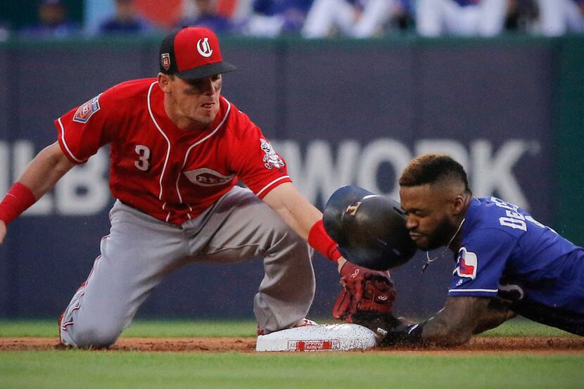 Texas Rangers center fielder Delino DeShields (3) steals second base in the first inning as...