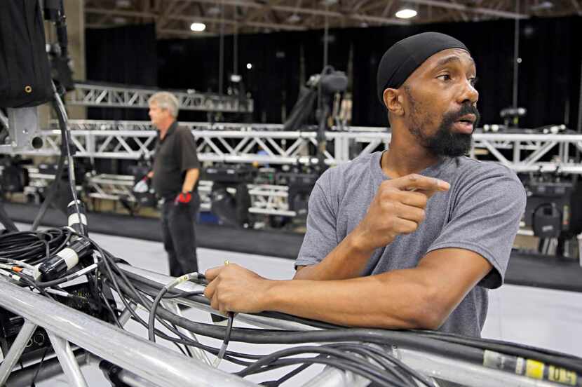 
Tillman Lawhon of Chicago-based Live International helped assemble stage lighting Tuesday...