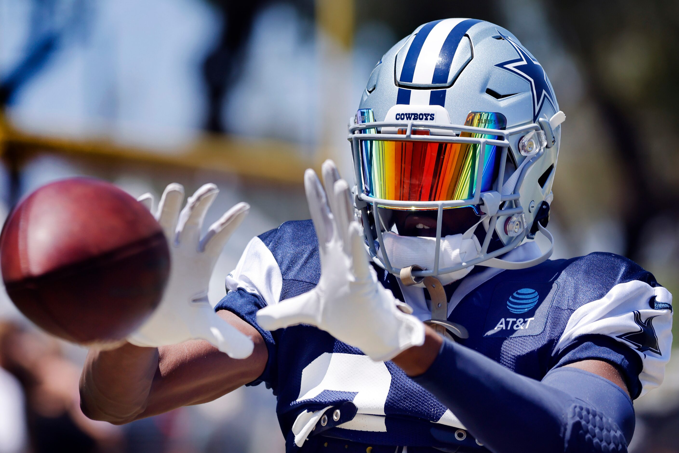 Dallas Cowboys safety Israel Mukuamu (24) catches passes from a throwing machine at the end...