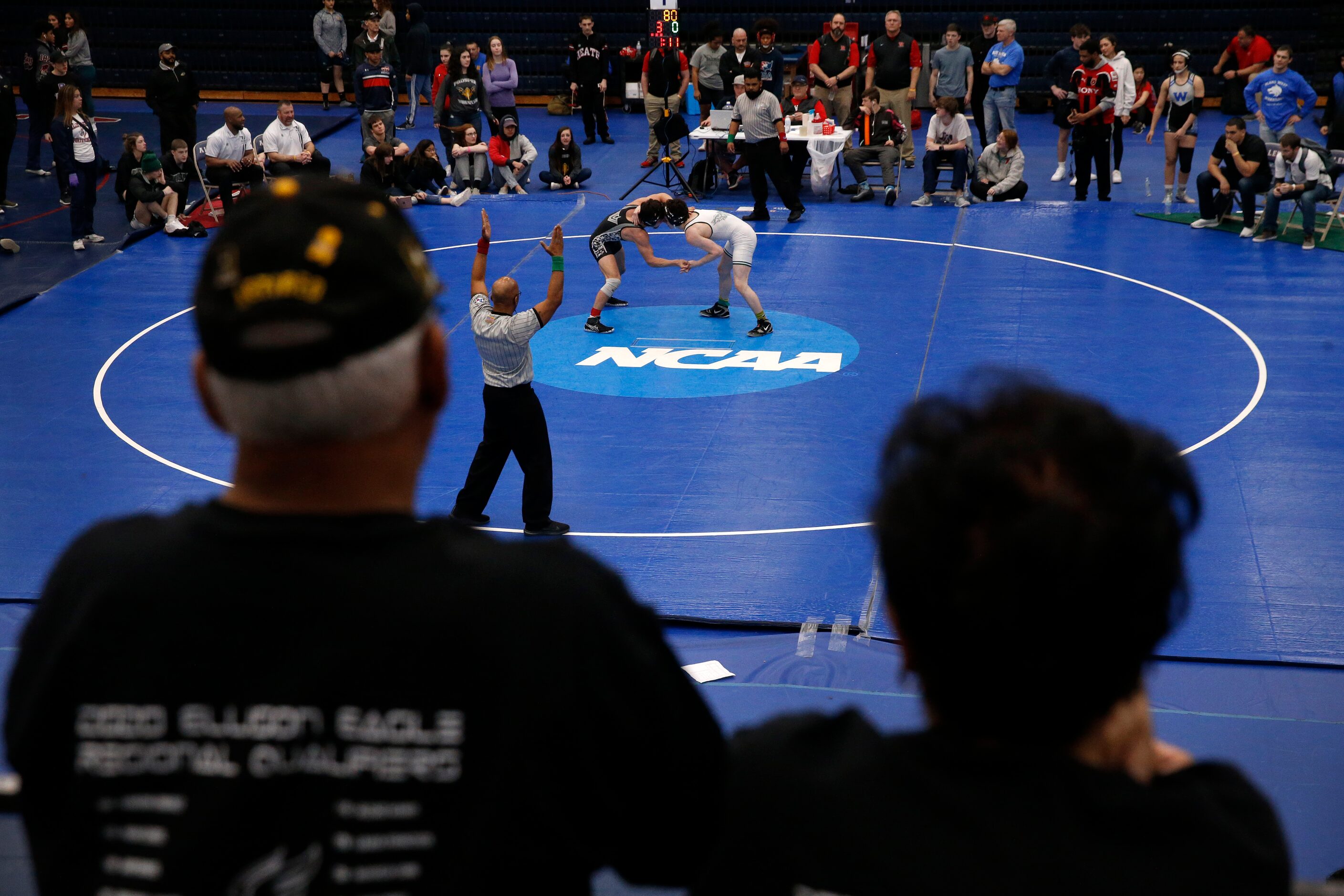 Prosper High wrestler John Richardson (right) and Austin Vandergrift's Luke Sloan tie up...