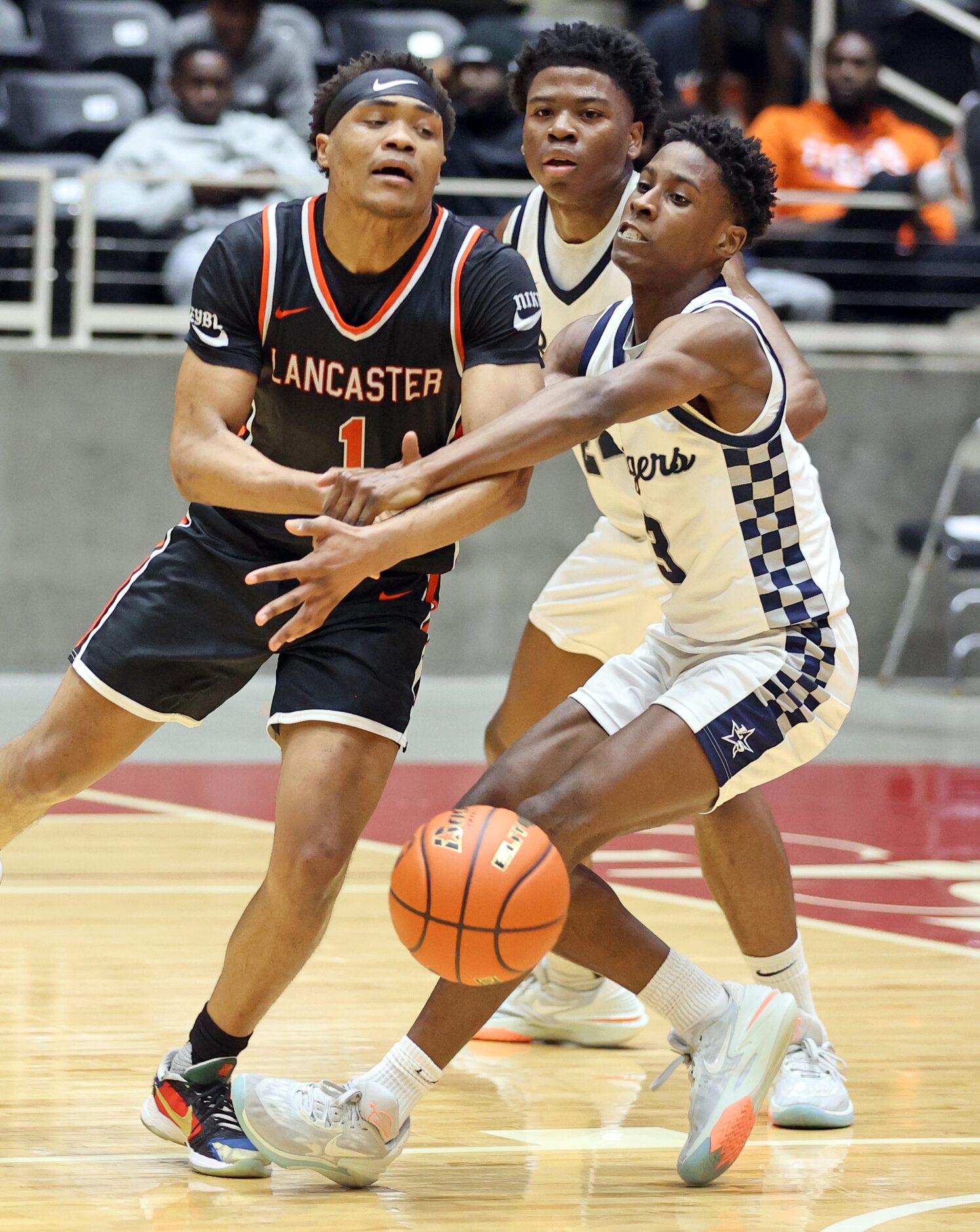 Frisco Lone Star G Josh Weems (3) knocks the ball from the hands of Lancaster's Deontrell...