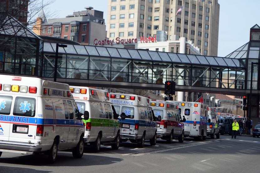 Ambulances line the streets near Copley Square following multiple bomb blasts near the...