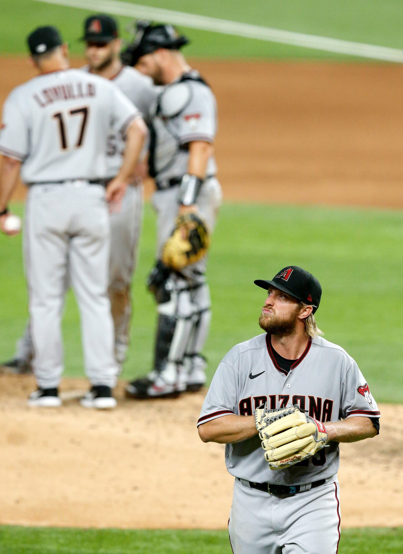 Arizona Diamondbacks starting pitcher Merrill Kelly (29) walks to the dugout during the...