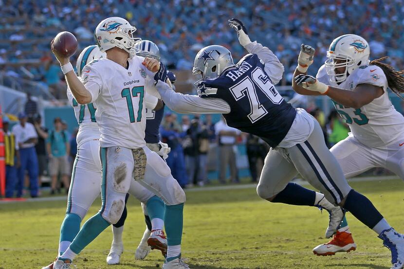 Dallas Cowboys defensive end Greg Hardy (76) puts some pressure on Miami Dolphins...
