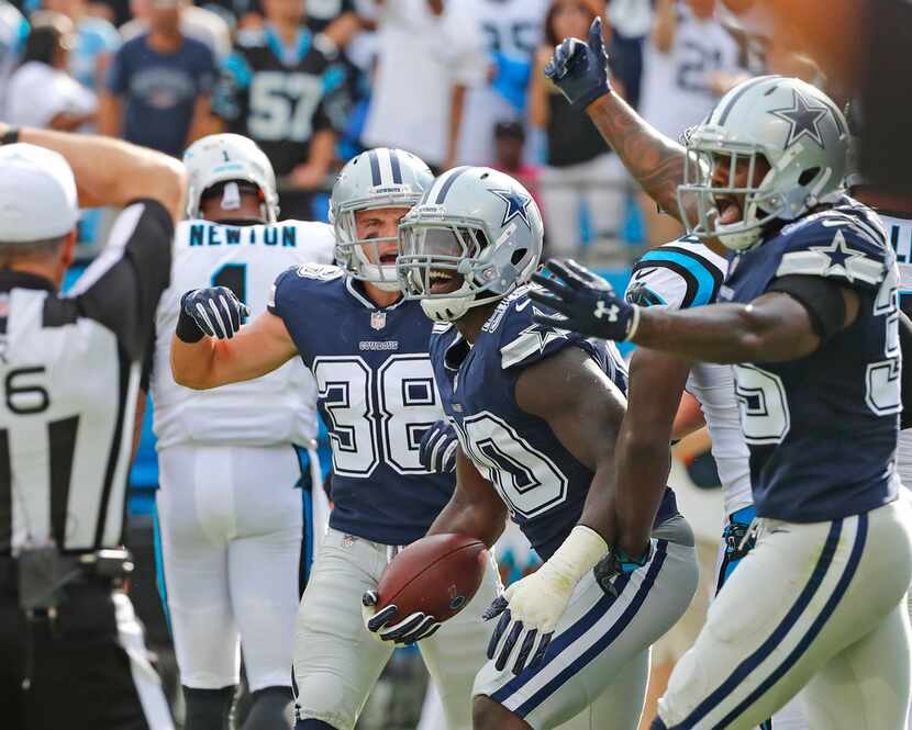 Dallas Cowboys defensive end Demarcus Lawrence (90) celebrates his first quarter fumble...